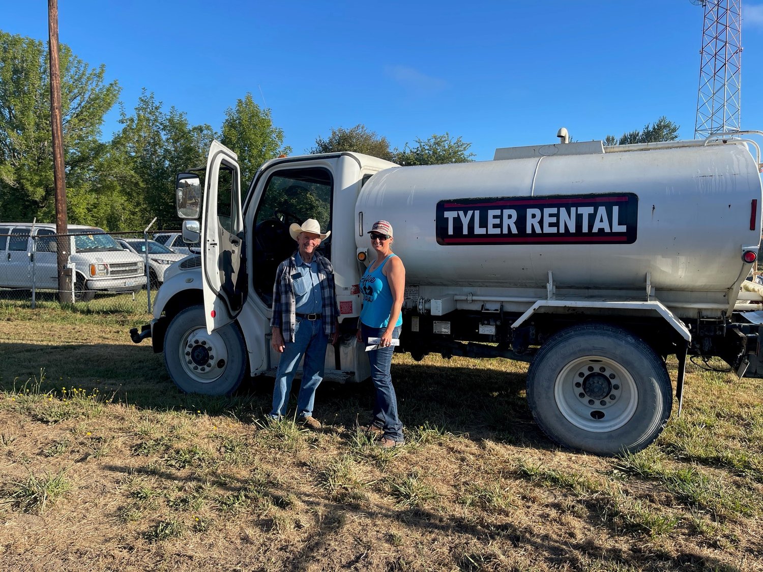 Pictured with the Tyler Rental water tender are Adam Kasper, a longtime Southwest Washington Fair Horse Department volunteer, and Horse Department Superintendent Anne Hamilton.